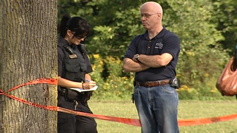 Police gather information at the scene near the CEGEP campus in Gatineau, Wednesday, Aug. 24, 2011.