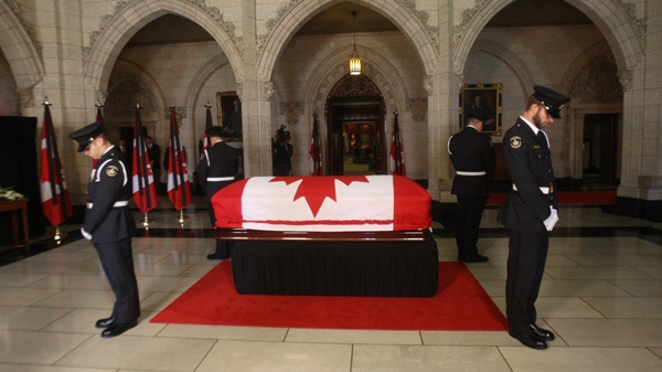 The body of NDP Leader Jack Layton lies in state in Centre Block on Parliament Hill in Ottawa on Wednesday, Aug. 24, 2011. (Ryan Remiorz / THE CANADIAN PRESS)