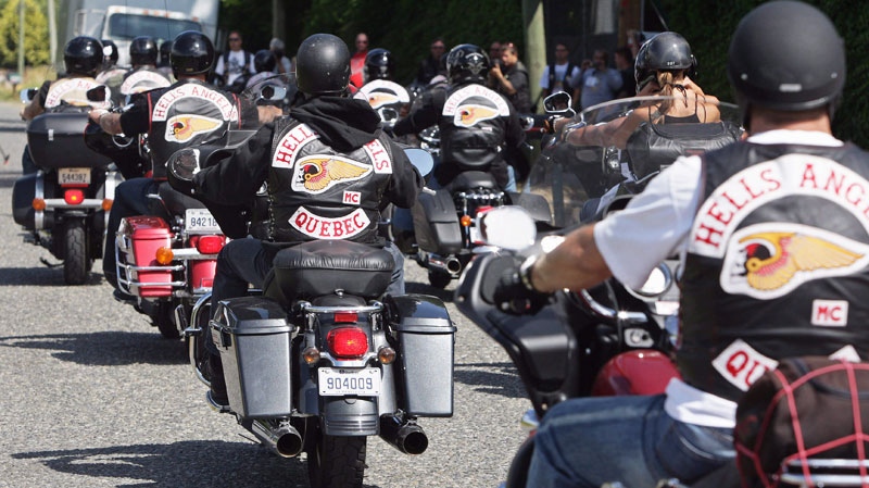 Quebec members of the Hell's Angels motorcycle gang arrive at the White Rock, B.C., chapter's property in Langley, B.C., on Friday July 25, 2008. (Darryl Dyck / THE CANADIAN PRESS)