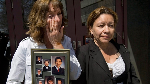 Isabelle Hains, left, and Ana Acevedo head from the court house in Bathurst, N.B. on Thursday, May 14, 2009 at the end of the inquest into the van crash that took the lives of seven high school basketball players and a teacher 16 months ago. (Andrew Vaughan / THE CANADIAN PRESS)