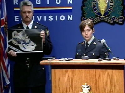 Officers from RCMP 'E' Division display an image of one of the shoes found, during a press conference in Vancouver on Thursday, July 10, 2008.