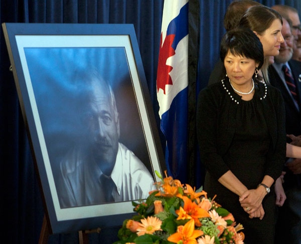 Olivia Chow, wife of the late NDP leader Jack Layton, looks at a photo at Toronto City Hall on Friday, Aug. 26, 2011. (Ryan Remiorz / THE CANADIAN PRESS)  