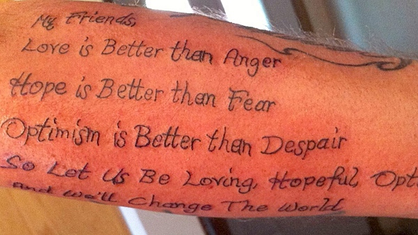 A fresh tattoo on Troy Oakley's arms show a passage from Jack Layton's Letter to Canadians, on Friday Aug. 26, 2011, in Oshawa, Ont. (The THE CANADIAN PRESS/HO, Troy Oakley)