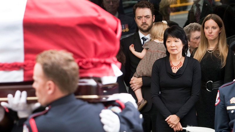 Olivia Chow and family members look on as the coffin of NDP leader Jack Layton leaves Roy Thomson Hall after his state funeral, Saturday, Aug. 27, 2011 in Toronto.(Ryan Remiorz / THE CANADIAN PRESS)