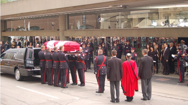 Jack Layton's casket is carried into a hearse following his state funeral at Roy Thomson Hall in Toronto on Aug. 27, 2011. (Michael Stittle / CTVNews.ca)