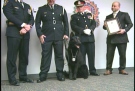 Trax, centre, gets his badge as the first member of the St. Thomas Police Service's K9 Unit in London, Ont. on Thursday, Jan. 16, 2014.
