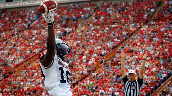 Montreal Alouettes Jamel Richardson celebrates his second touchdown during first half CFL football action against the Calgary Stampeders in Calgary, Alta., Saturday, Aug. 27, 2011. THE CANADIAN PRESS/Jeff McIntosh