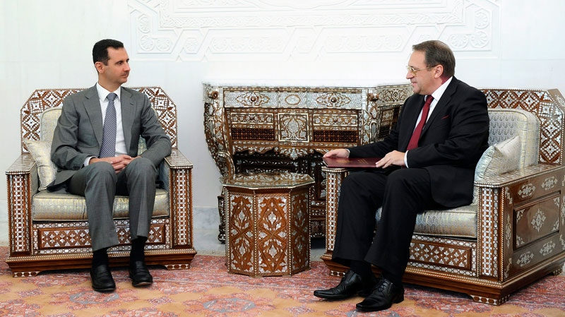 In this photo released by the Syrian official news agency SANA, Syrian President Bashar Assad, left, meets with senior Russian envoy Mikhail Bogdanov, right, who expressed Moscow's support for Assad's plans for reform in Syria, at the presidential palace in Damascus, on Monday Aug. 29, 2011. (AP / SANA)