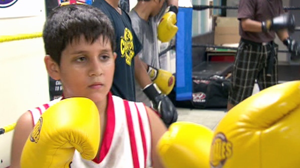 11-year-old Cosmo practices boxing at the Cabbagetown Boxing Club in Toronto in this undated photo.