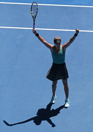 Eugenie Bouchard raises her arms some more after b