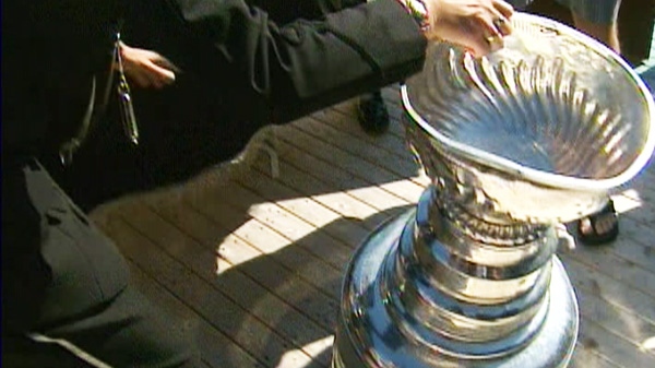 A dented Stanley Cup is seen moments after if fell over in Bonavista., N.L., the hometown of former Boston Bruin Michael Ryder, on Tuesday, Aug. 30, 2011.