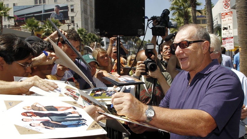 Actor Ed O'Neill signs autographs for fans after receiving a star of the Hollywood Walk of Fame in Los Angeles, Tuesday, Aug. 30, 2011. (AP Photo/Matt Sayles)