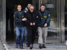 FBI agents flank Vincent Asaro as they escort the reputed mobster from FBI offices in lower Manhattan, Thursday, Jan. 23, 2014. (Newsday / Charles Eckert)