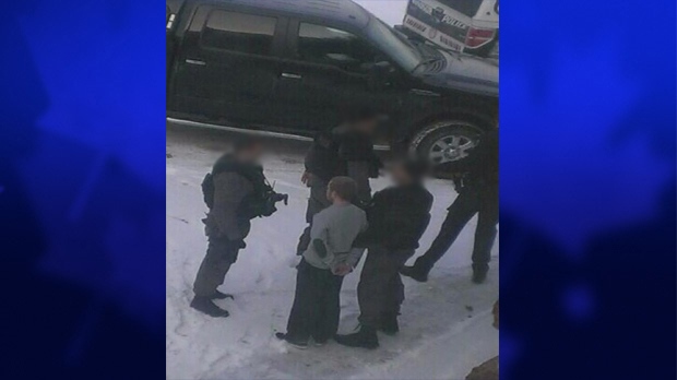 Windsor police can be seen arresting a suspect at Riverside High School in Windsor, Ont. in connection to alleged threats against a Windsor school on Thursday, Jan. 23. (Twitter/ CTV Windsor)