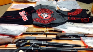 Winnipeg police showed off on Jan. 24, 2014 a range of guns and gang items seized from the Manitoba Warriors.