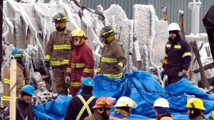 Emergency workers continue the search for victims at the scene of a fatal fire at a seniors residence  in L'Isle-Verte, Que., Saturday, Jan. 25, 2014. (Ryan Remiorz / THE CANADIAN PRESS)