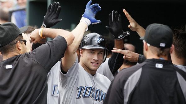 Toronto Blue Jays' Brett Lawrie, center, high-fives his teammates in the dugout after hitting a two-run home run in the eighth inning of a baseball game against the Baltimore Orioles on Thursday, Sept. 1, 2011, in Baltimore. Toronto won 8-6. (AP Photo/Patrick Semansky)