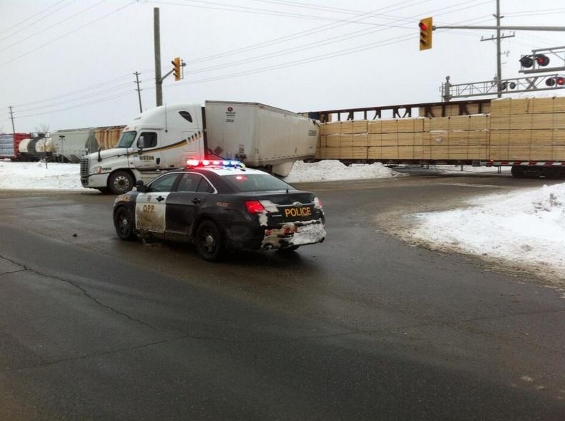 freight train hits tractor trailer