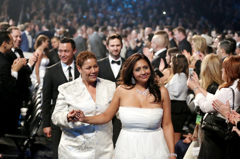 Audience members participate in a same sex wedding during a performance of "Same Love" by Macklemore and Ryan Lewis at the 56th annual Grammy Awards at Staples Center on Sunday, Jan. 26, 2014, in Los Angeles. (AP / Matt Sayles)