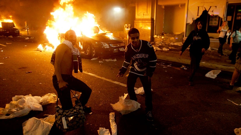 Vancouver Canucks hockey fans take part in a riot in downtown Vancouver on June 15, 2011, following the Vancouver Canucks 4-0 loss to the Boston Bruins in game 7 of the Stanley Cup hockey final. (Ryan Remiorz / THE CANADIAN PRESS)