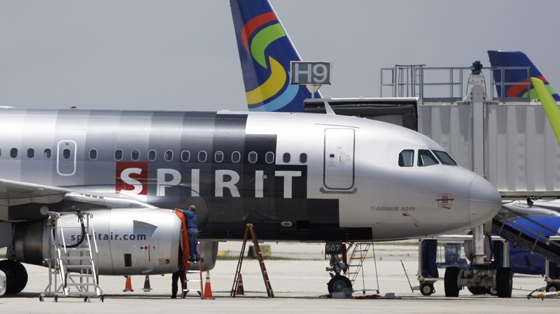 In this June 13, 2010 file photo, a Spirit Airlines airplane sits on the tarmac at Fort Lauderdale-Hollywood International Airport in Fort Lauderdale, Fla. (AP Photo/Lynne Sladky, File)