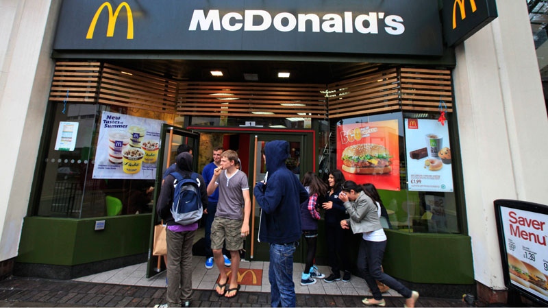 Youths gather outside a McDonald's restaurant in London, Sunday, Sept. 4, 2011. (AP / Lefteris Pitarakis)