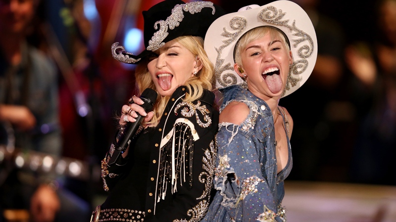 Miley Cyrus performs with Madonna for MTV