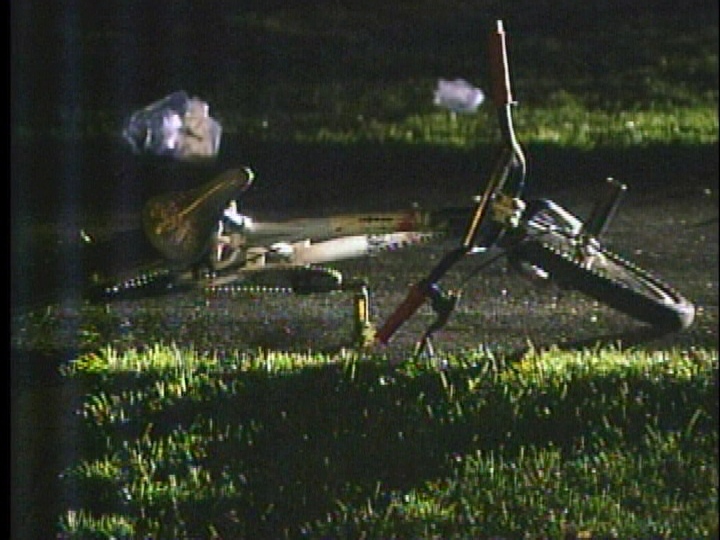 A bicycle is seen after a hit-and-run on Wexford Avenue in London, Ont. on Friday, Oct. 25, 2014.