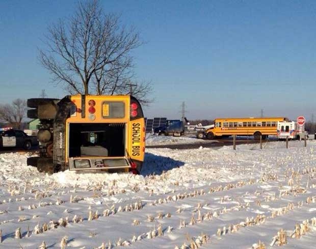 A collision involving two school buses sent one bus onto its side southwest of London, Ont. on Monday, Feb. 3, 2014. (Chuck Dickson / CTV London)