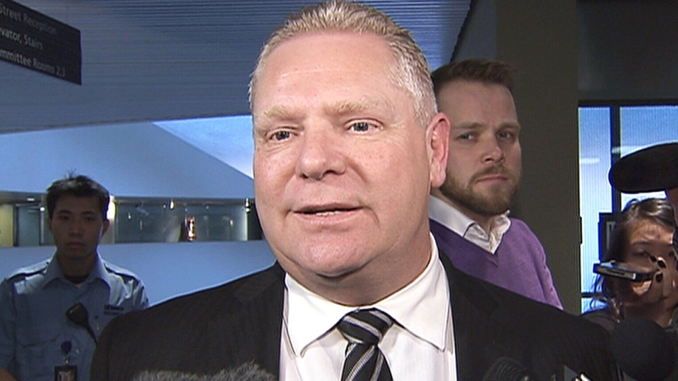 Coun. Doug Ford speaks to reporters at city hall