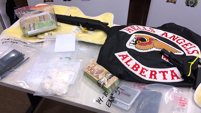 ALERT investigators displayed items seized January 30, during a massive coordinated search of four homes in north Edmonton and St. Albert.