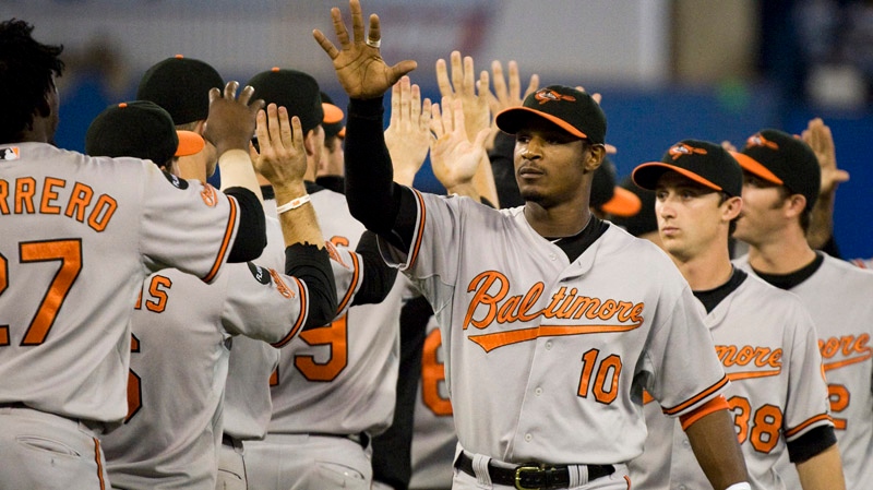 Baltimore Orioles Adam Jones(right) congratulates his team after defeating the Toronto Blue Jays 2-0 during MLB action in Toronto Friday September 9, 2011. THE CANADIAN PRESS/Aaron Vincent Elkaim