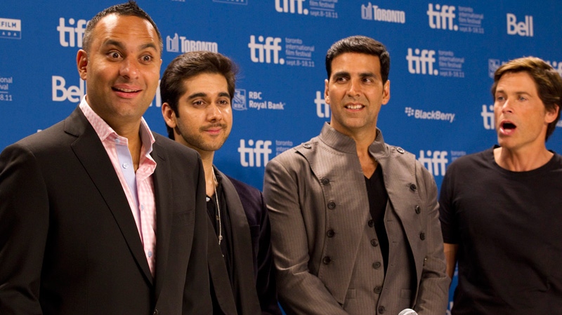 From left to right, Russel Peters, Vinay Virmani, Akshay Kumar and Rob Lowe poses for photos before the press conference for the film 'Breakaway' at the Toronto International Film Festival in Toronto on Saturday, Sept. 10, 2011. (Frank Gunn / THE CANADIAN PRESS)