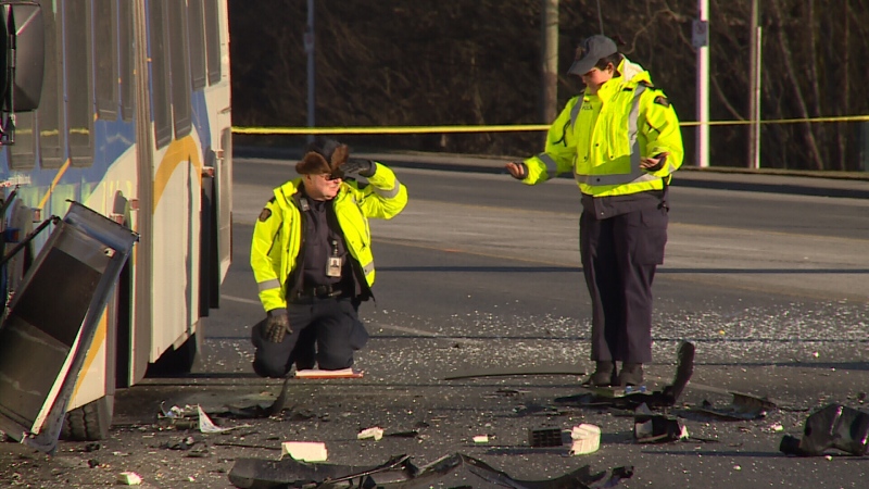 Police investigate a fatal collision between a bus and a car on King George Boulevard in Surrey Feb. 8, 2014. (CTV)
