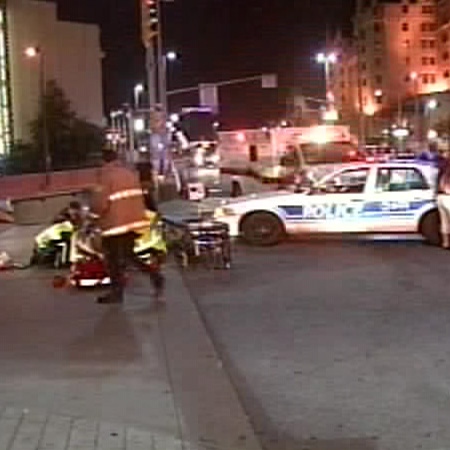 Emergency crews attend the scene of a hit-and-run on Rideau Street and Colonel By Drive in Ottawa, Sunday, July 13, 2008.