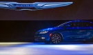 In this Monday, Jan. 13, 2014, file photo, a Chrysler 200 sedan drives on stage at its introduction, at the North American International Auto Show in Detroit, Mich. Chrysler reports quarterly financial results before the market open on Wednesday, Jan. 29, 2014. (AP /Tony Ding)