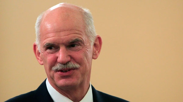 Greek Prime Minister George Papandreou laughs during a ceremony at the presidential palace in Athens, Wednesday, Sept. 14, 2011. (AP / Thanassis Stavrakis)