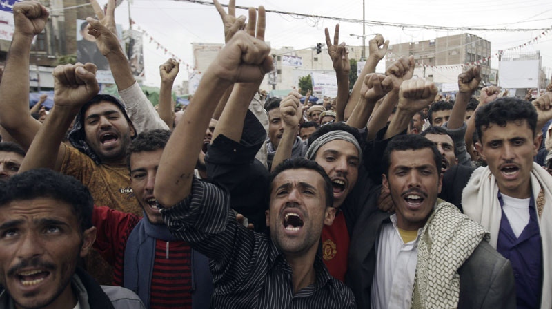 Yemeni protestors chant slogans during a demonstration demanding the resignation of Yemeni president Ali Abdullah Saleh in Sanaa, Yemen Wednesday, Sept. 14, 2011. (AP Photo/Hani Mohammed)
