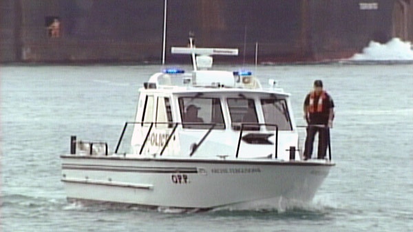 An OPP Search and Rescue boat helps in the search for a missing diver in the St. Clair River near Sarnia, Ont. on Tuesday, Sept. 13, 2011.