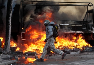 Riot police clash with protesters in Ukraine