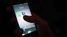 WhatsApp and Facebook app icons are shown on an iPhone in New York in this February 2014 file photo. (AP Photo/Karly Domb Sadof)