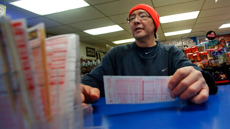 Buting a Powerball lottery ticket in Mass.