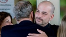 Fabrizio Gatti, brother of former boxer Arturo Gatti, is consoled by a family member as he attends his brother's visitation at Magnus Poirier funeral home in Montreal on July 19, 2009. (Graham Hughes / THE CANADIAN PRESS)