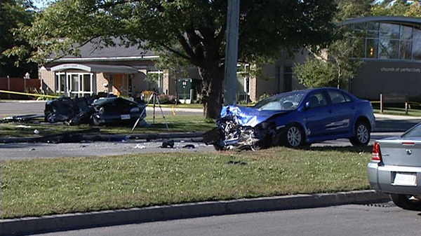 Damaged vehicles lie off Hunt Club Road following a head-on crash Monday, Sept. 19, 2011.