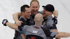 Canada's men's curling team as seen clockwise, Brad Jacobs, Ryan Harnden, Ryan Fry and E.J. Harnden celebrate after beating Britain to win the men's curling gold medal game at the 2014 Winter Olympics Friday, Feb. 21, 2014, in Sochi, Russia. (AP / Wong Maye-E)