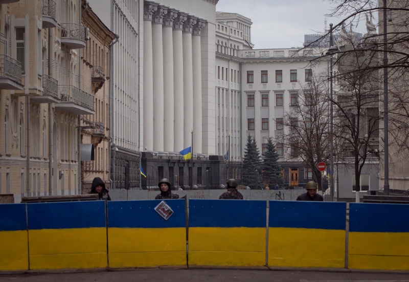 Protesters stand guard in front of presidential administrative building in central Kyiv, Ukraine, Saturday, Feb. 22, 2014. (AP / Darko Bandic) 