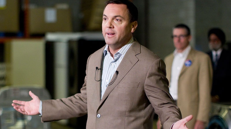PC Leader Tim Hudak speaks to journalists at a media availability in a warehouse in Etobicoke, Ontario during his election campaign for the Ontario Premiership on Monday September 19, 2011. THE CANADIAN PRESS/Chris Young