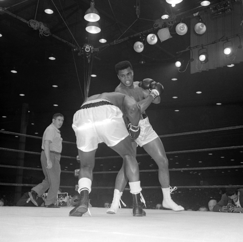 Muhammad Ali, then know as Cassius Clay, is shown on Feb. 25, 1964 in Miami during a match against Sonny Liston, when Ali became world heavyweight boxing champion. 