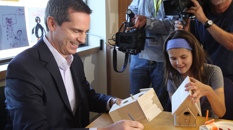 Liberal Leader Dalton McGuinty paints a bird house with 12-year-old patient Bryanne Gagnon at the Children's Hospital of Eastern Ontario (CHEO) in Ottawa, Ont., Monday, Sept. 19, 2011. (Patrick Doyle / THE CANADIAN PRESS)