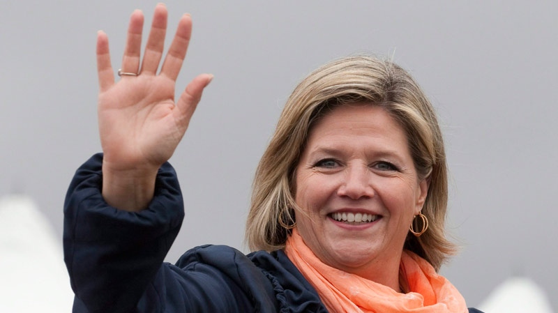 Ontario NDP Leader Andrea Horwath waves as she rides a float in the opening parade at the International Plowing Match in Chute-a-Blondeau, Ont., Tuesday, Sept. 20, 2011. (Adrian Wyld / THE CANADIAN PRESS)